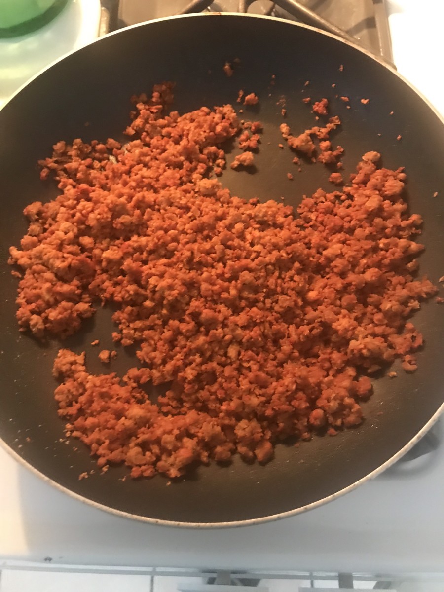 Cooking the Gardein beefless ground with seasonings.