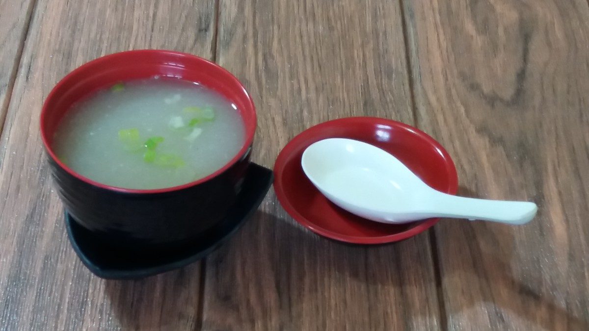 Miso soup with water spinach and spring onions