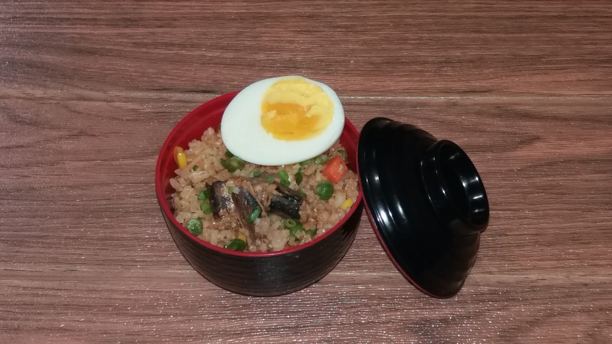 canned sardines fried rice with perfectly cooked boiled egg