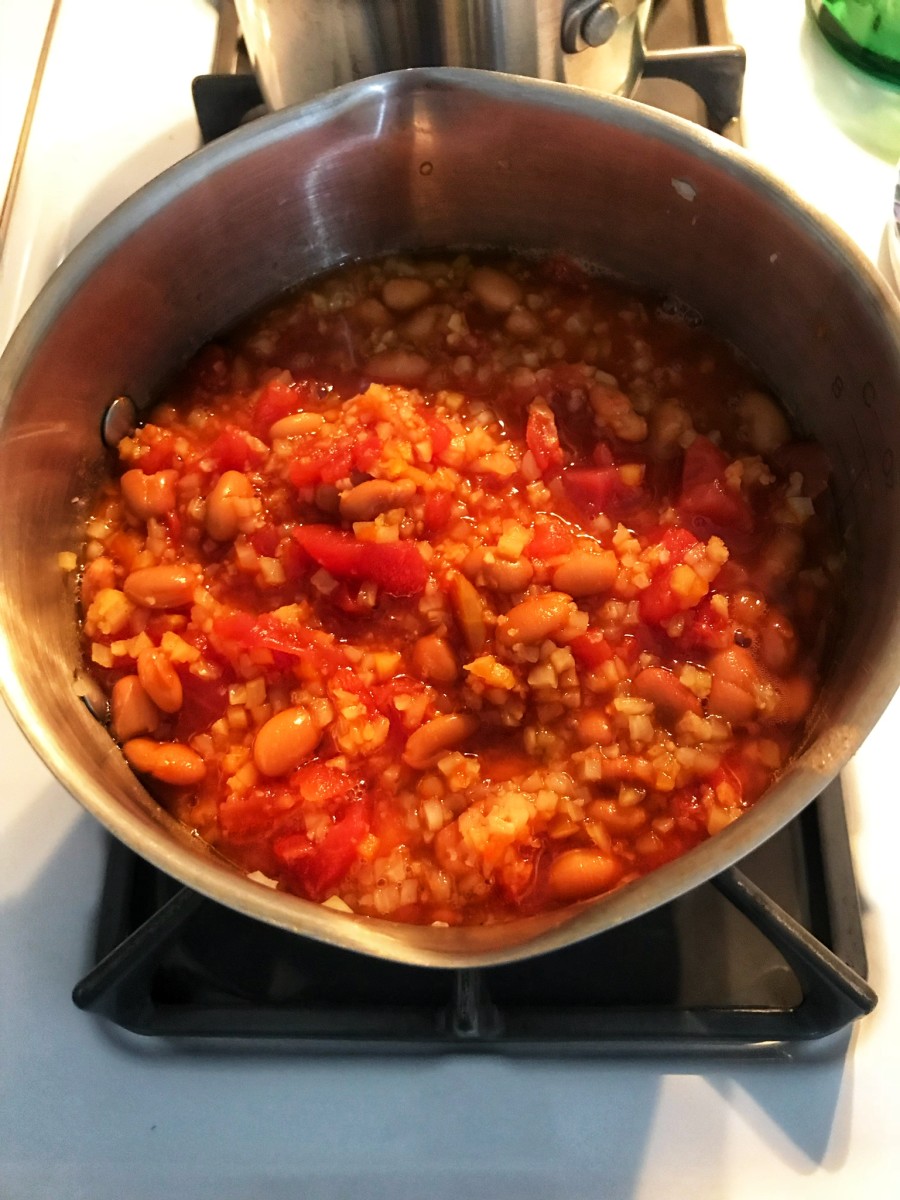 Cooking the beans and tomatoes.