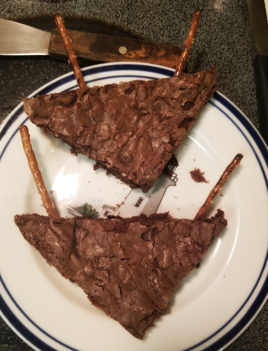 Step 3: Put two pretzel sticks on either side of the brownie to create antlers.