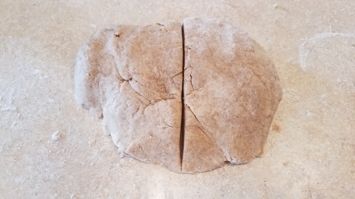 Knead it together with your hands to combine all ingredients. You want a nice soft dough. Cut it into two pieces for your two pie crusts.
