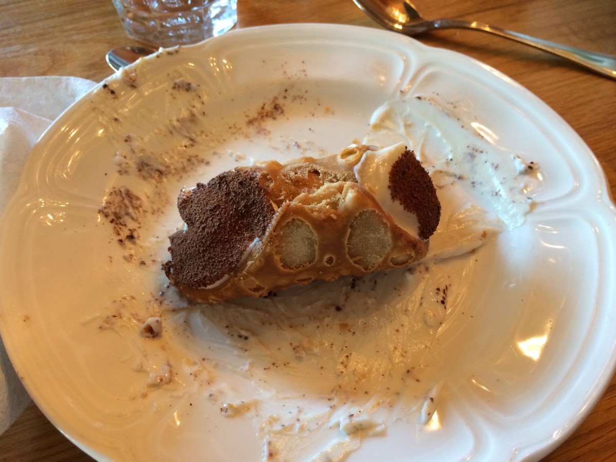 My friend enjoyed a cannoli for dessert.