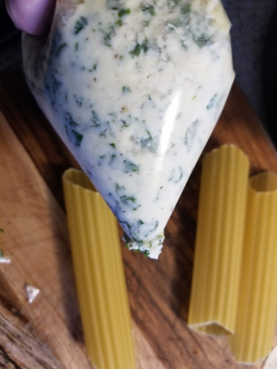 Cheese and kale filling in the piping bag