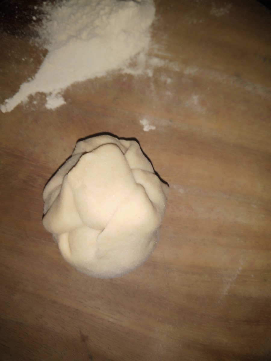 Bring the edges of the dough together. Seal it properly.