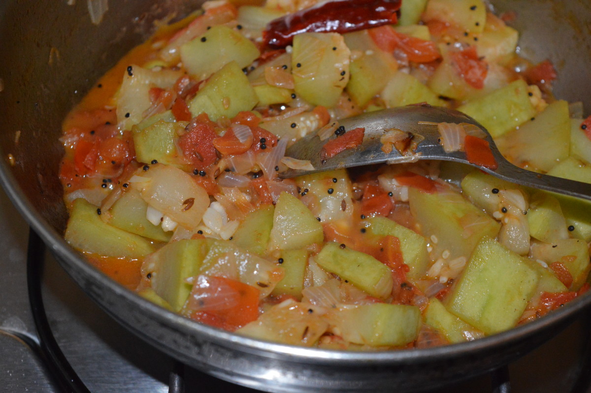 Cover the pan and cook until the bottle gourd gets cooked.