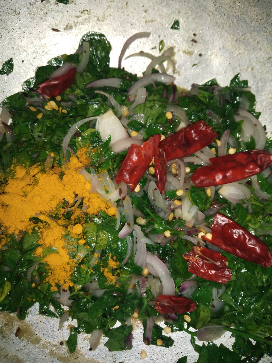 Add turmeric powder, salt and dried red chilies. Cook on medium flame without adding water for 5 to 6 minutes.