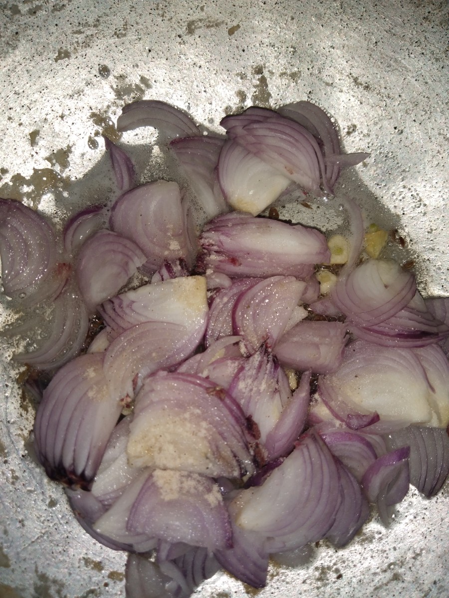 Add the chopped onion and hing. Fry till brown.