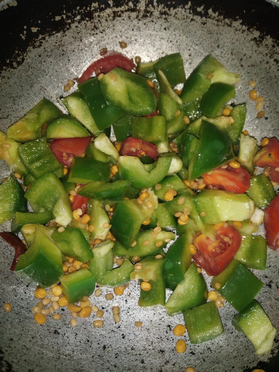 Add chopped capsicum. Fry and cook until soft.