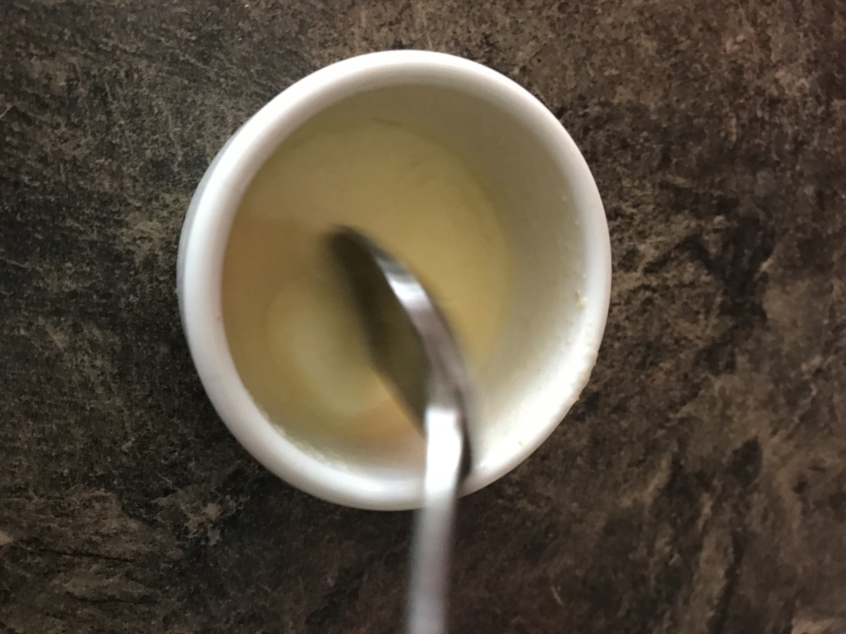 Place butter, garlic powder, and lemon juice in a small microwave-safe cup. 