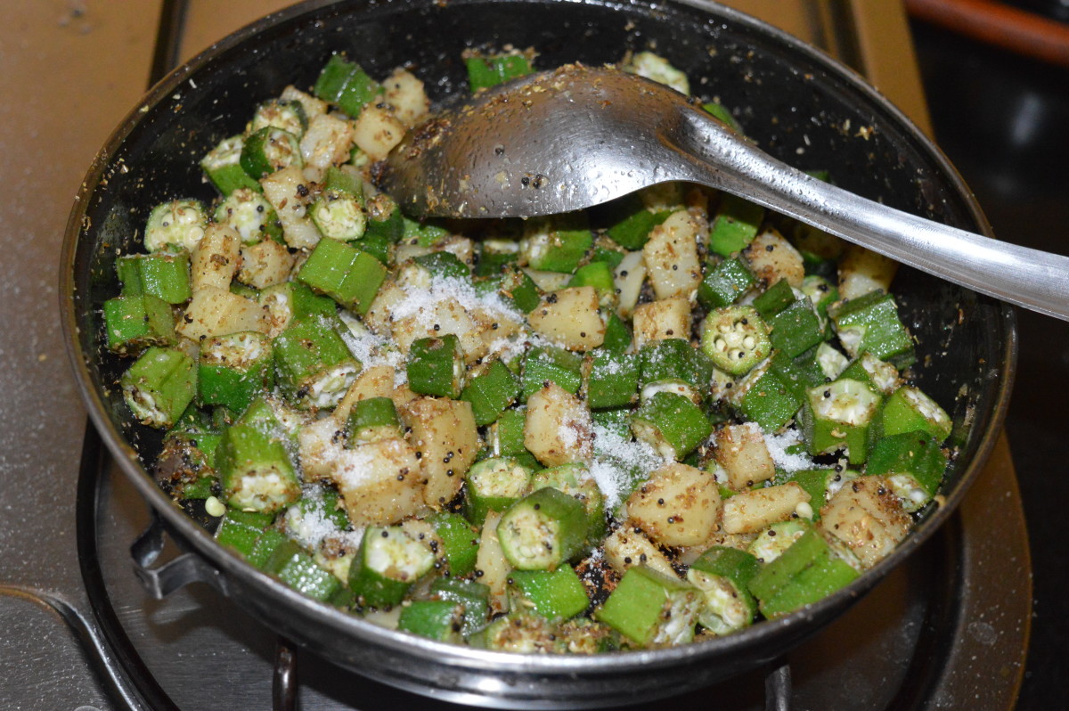 Mix well. Stir the mix occasionally and cook until okra and potato become tender. 