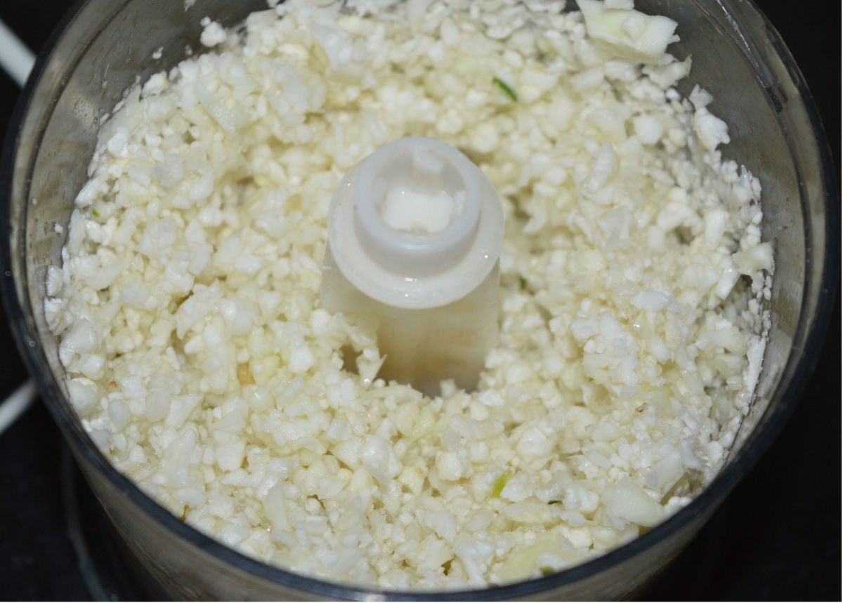 The finely chopped cauliflower, ginger, and green chilies.