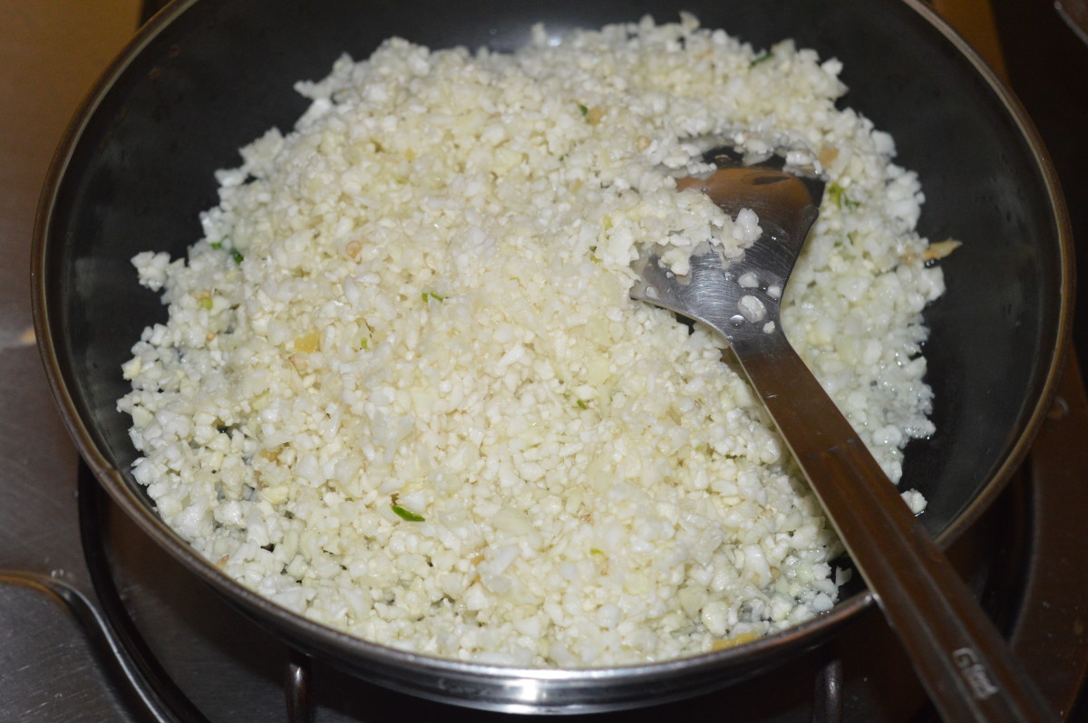 Step three: Heat oil in a deep pan. Add cauliflower mixture. Add some salt. Saute over a high flame for 3 minutes.