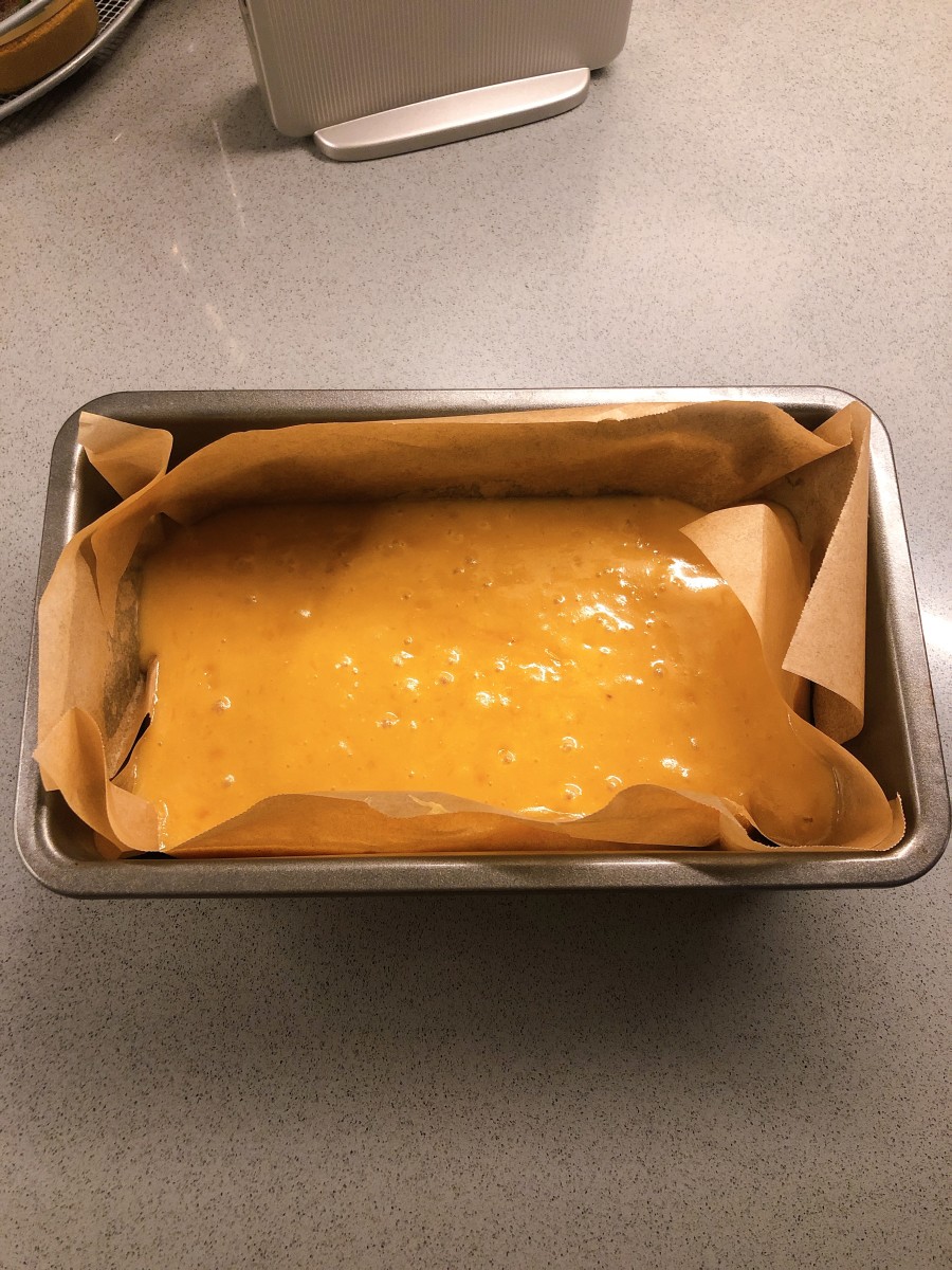 Pour the batter into a baking pan that is lined with parchment paper. 