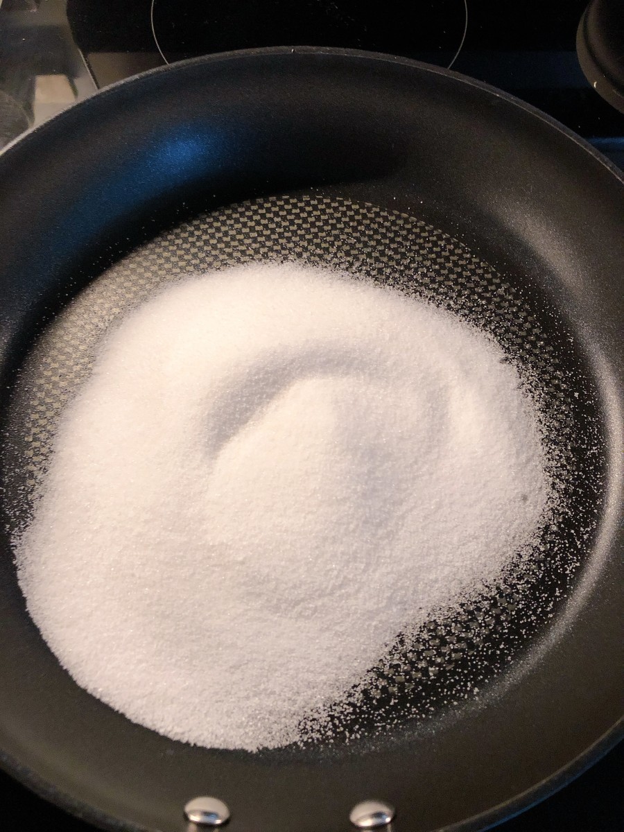Place the sugar in a pan over medium heat. 