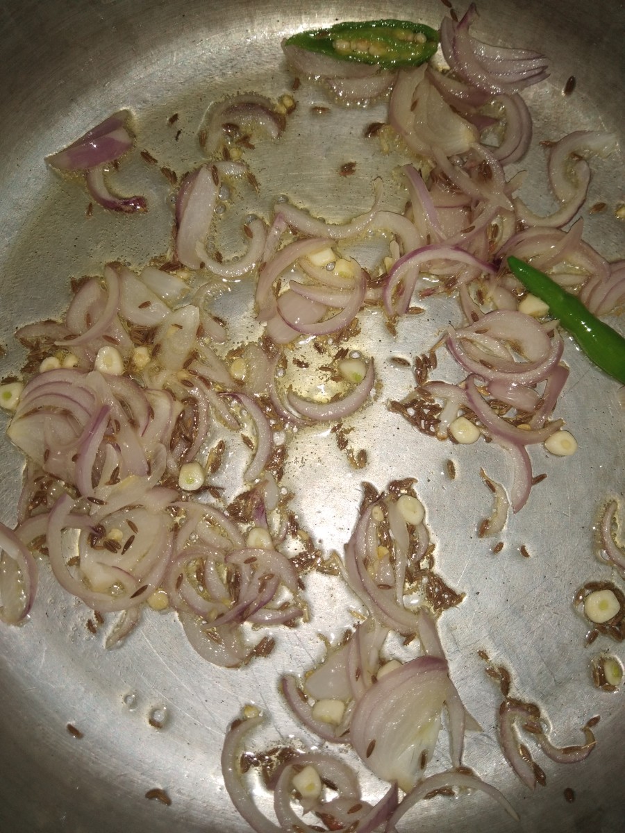 Saute until the onion turns translucent and the garlic smells good.