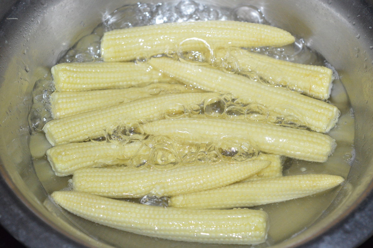 Parboil baby corn in water mixed with some salt.