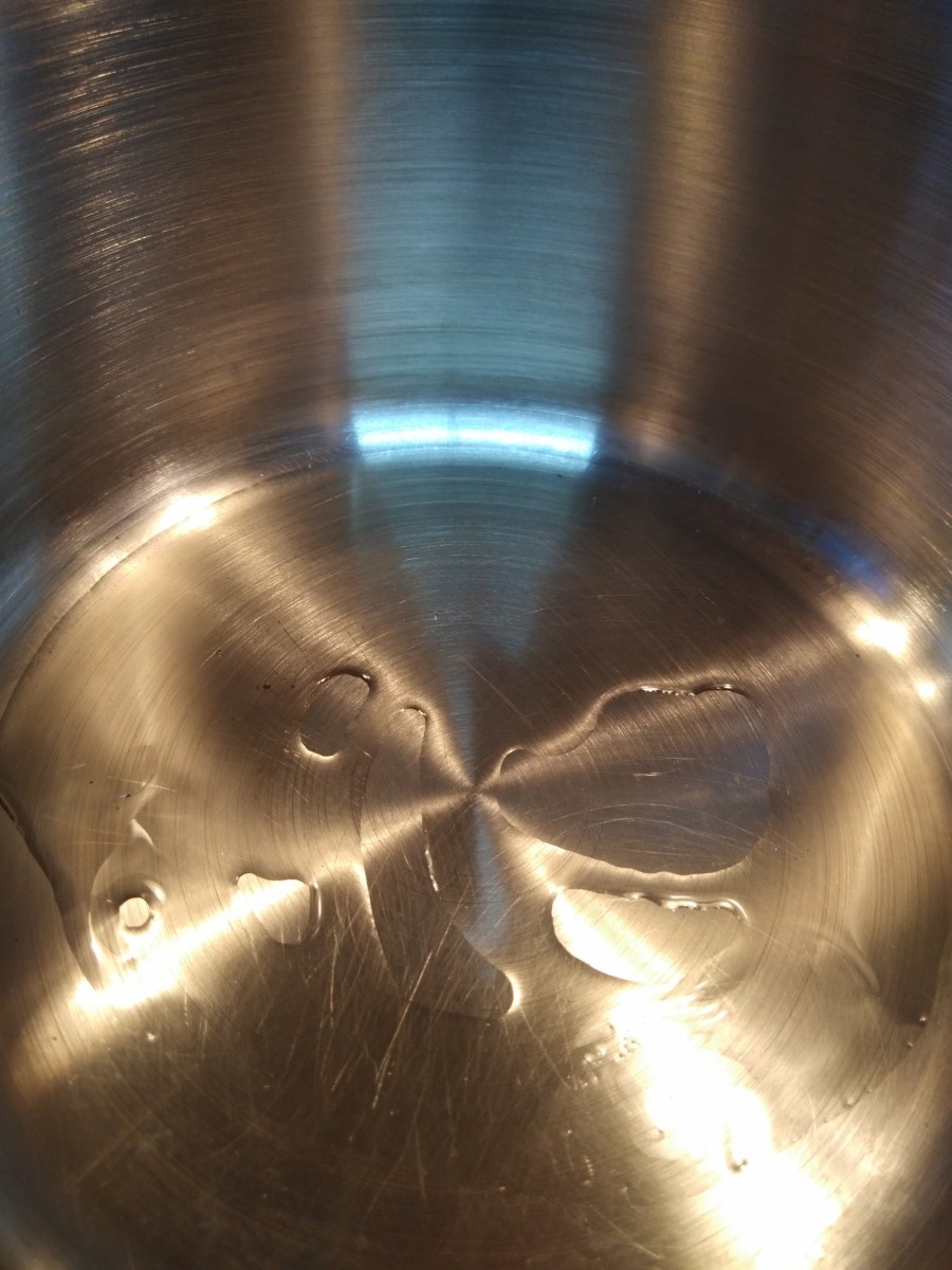 Heat oil in a pan or pot.