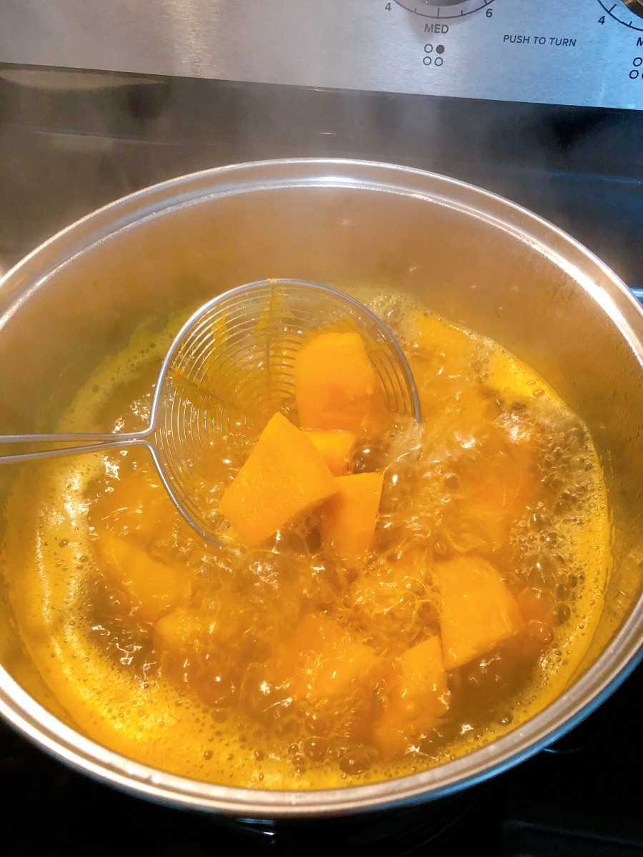 Transfer the pot onto the stove over high heat. Boil the pumpkin until it is soft. 