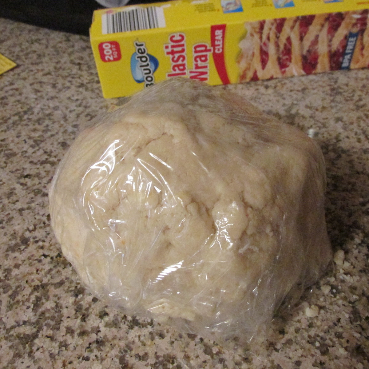 Wrap cookie dough in plastic wrap.