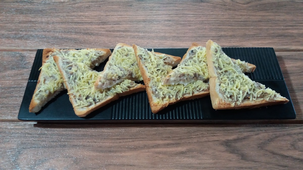 Open-faced cheesy sardine sandwiches, ready to serve