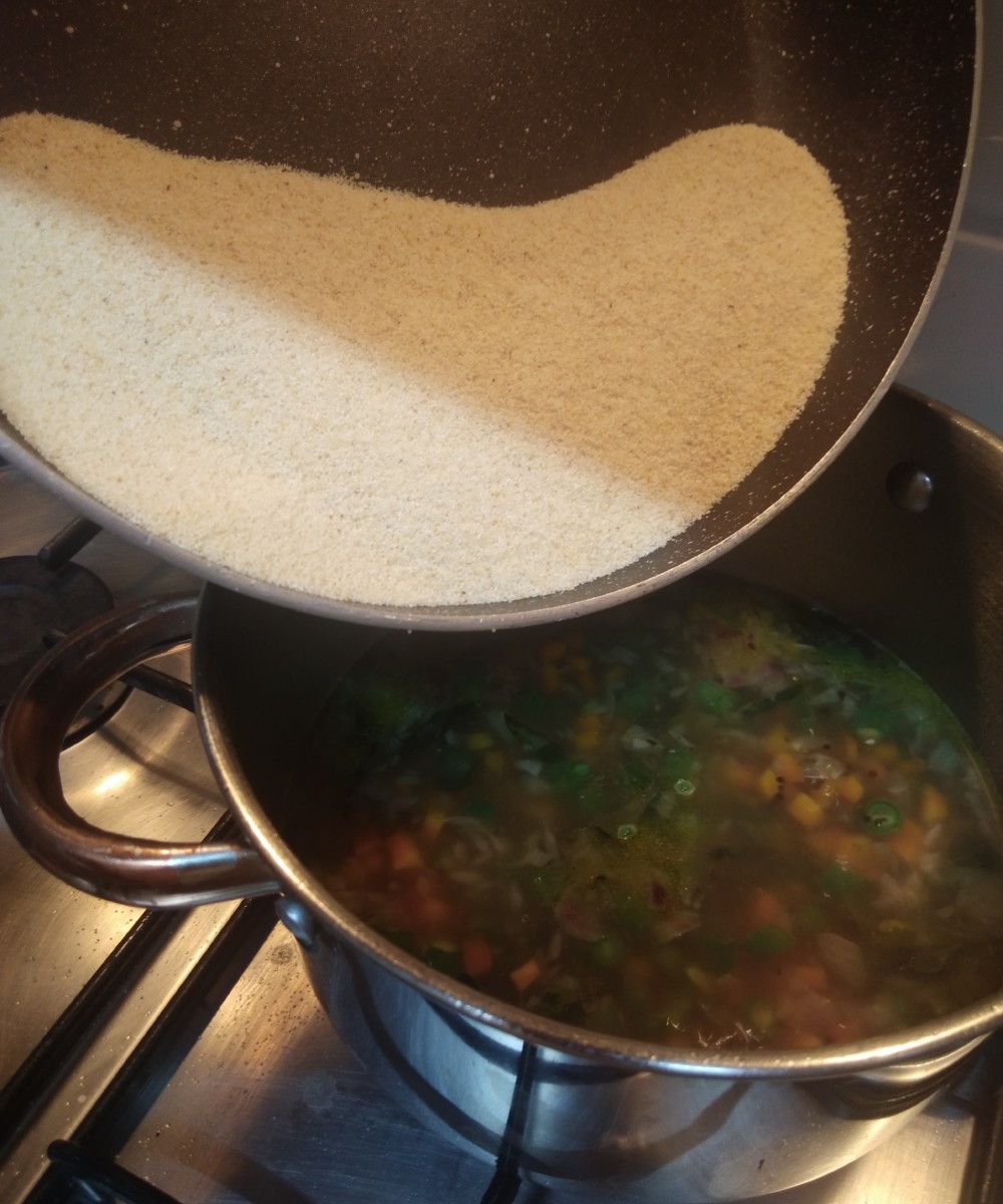 Now add roasted rava little by little stirring constantly to avoid lumps formation. 