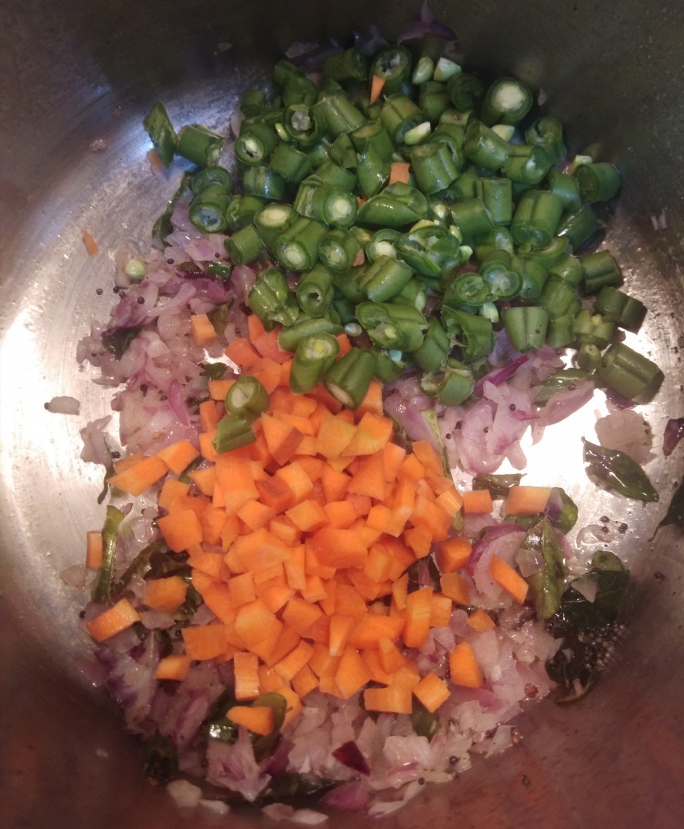 Add chopped carrot and beans. (Add other vegetables too if using.)