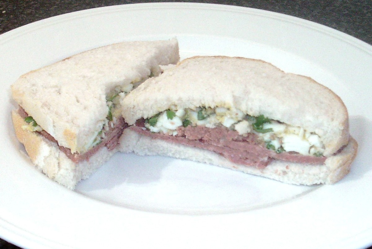 Boiled egg mashed with parsley accompanies the corned beef in this tasty sandwich