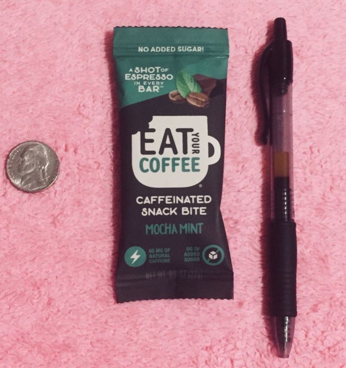 This is a wrapped Mocha Mint bite with a pen and nickel for scale.