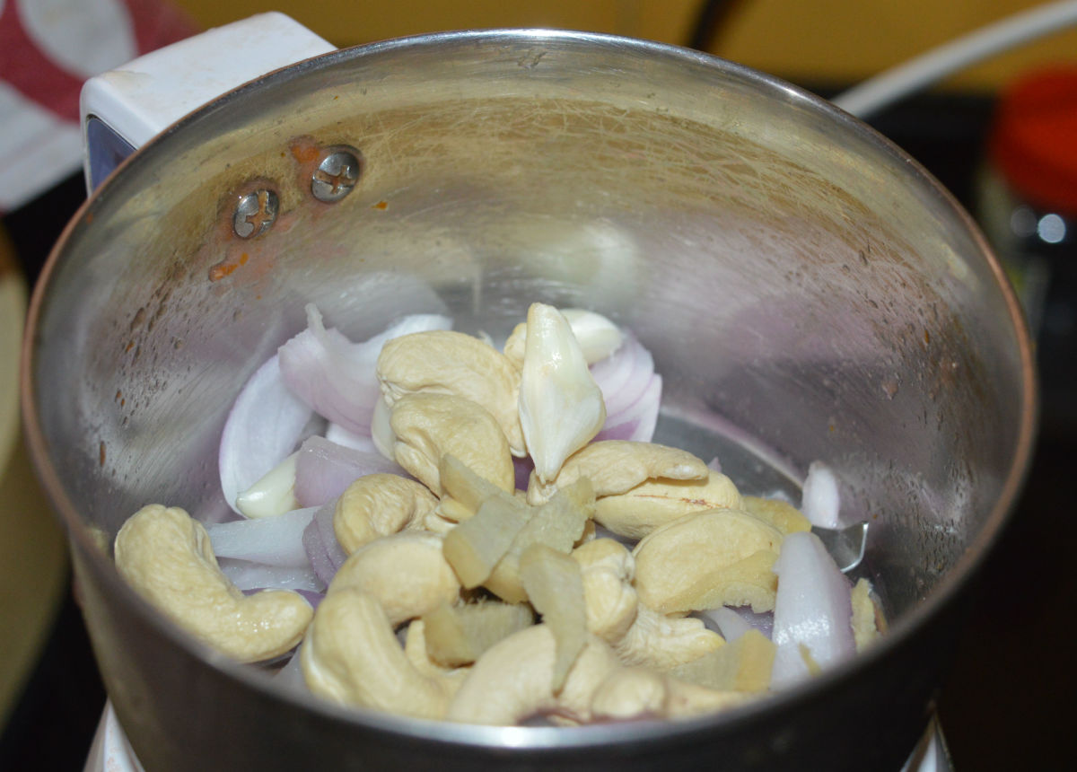 Step two: Make a paste of cashew nuts, onions, ginger, and garlic.