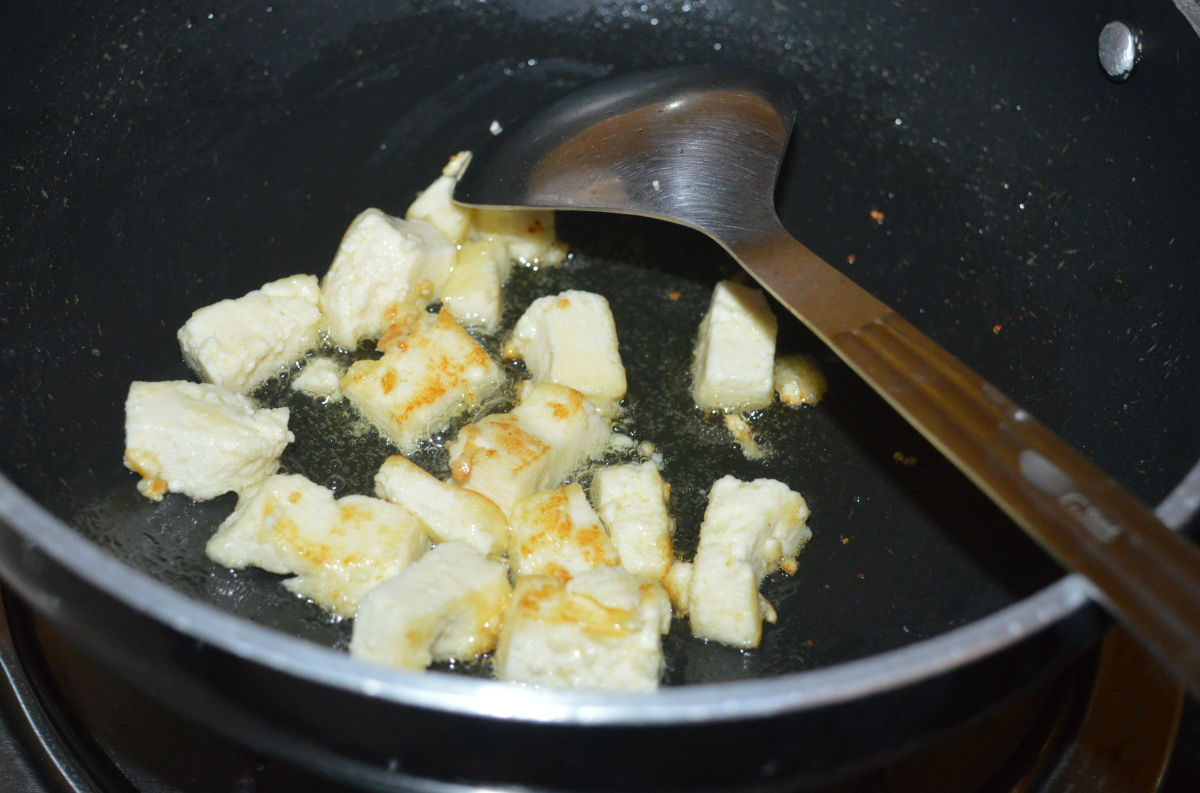 Step three: Saute the paneer pieces in oil until they become golden. Transfer the paneer to a plate.