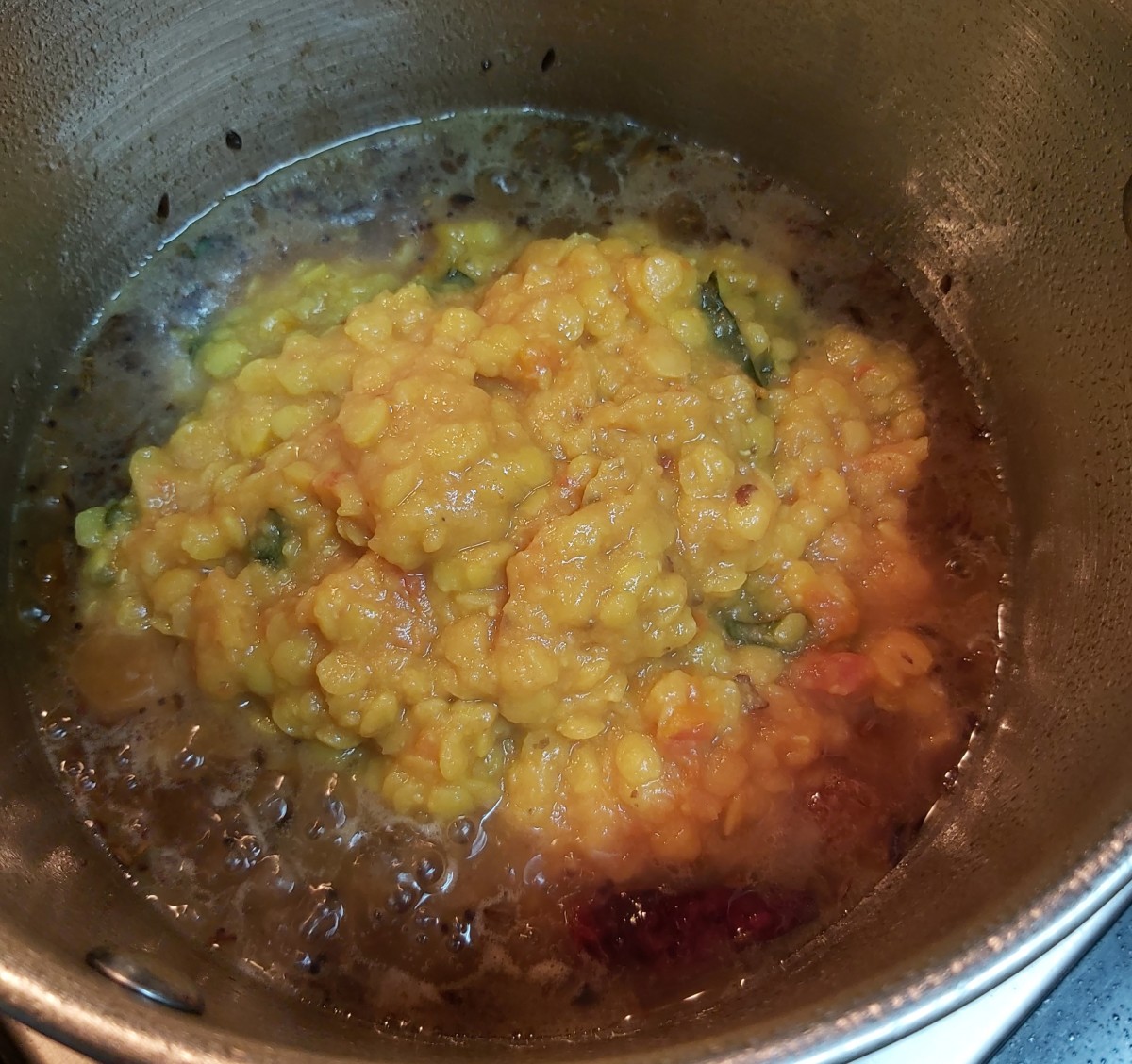 Add mashed dal mixture and mix well.