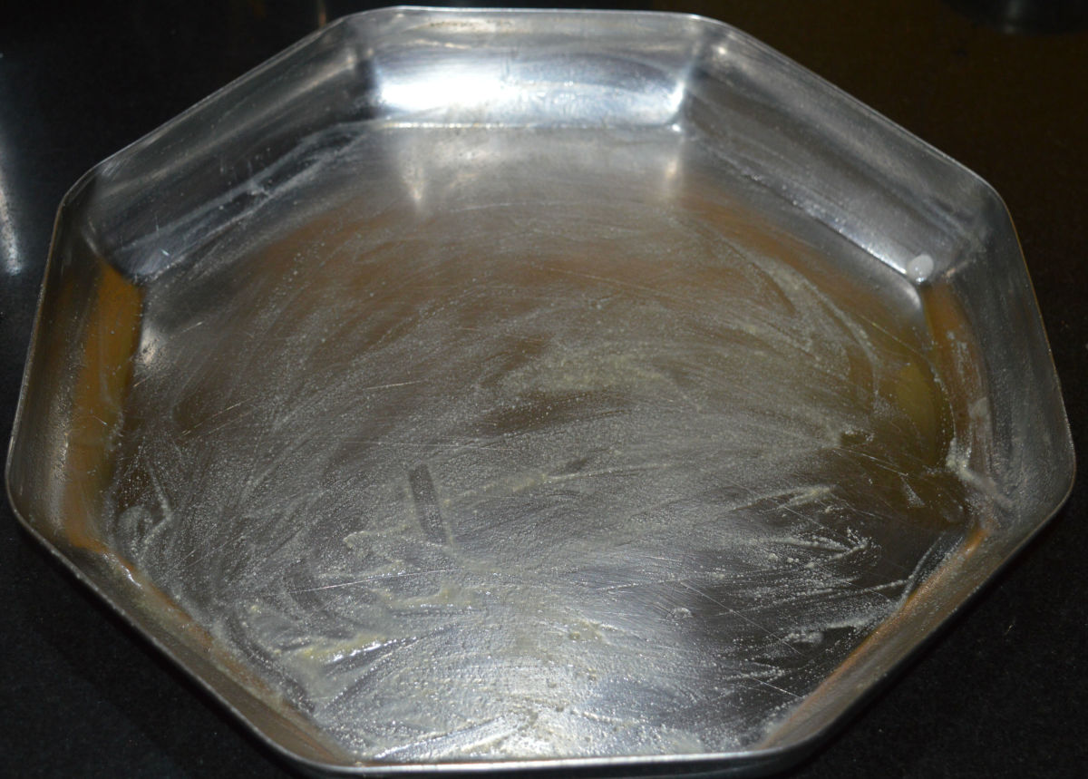 Grease a plate with ghee. This plate is for pouring the hot besan burfi mixture.