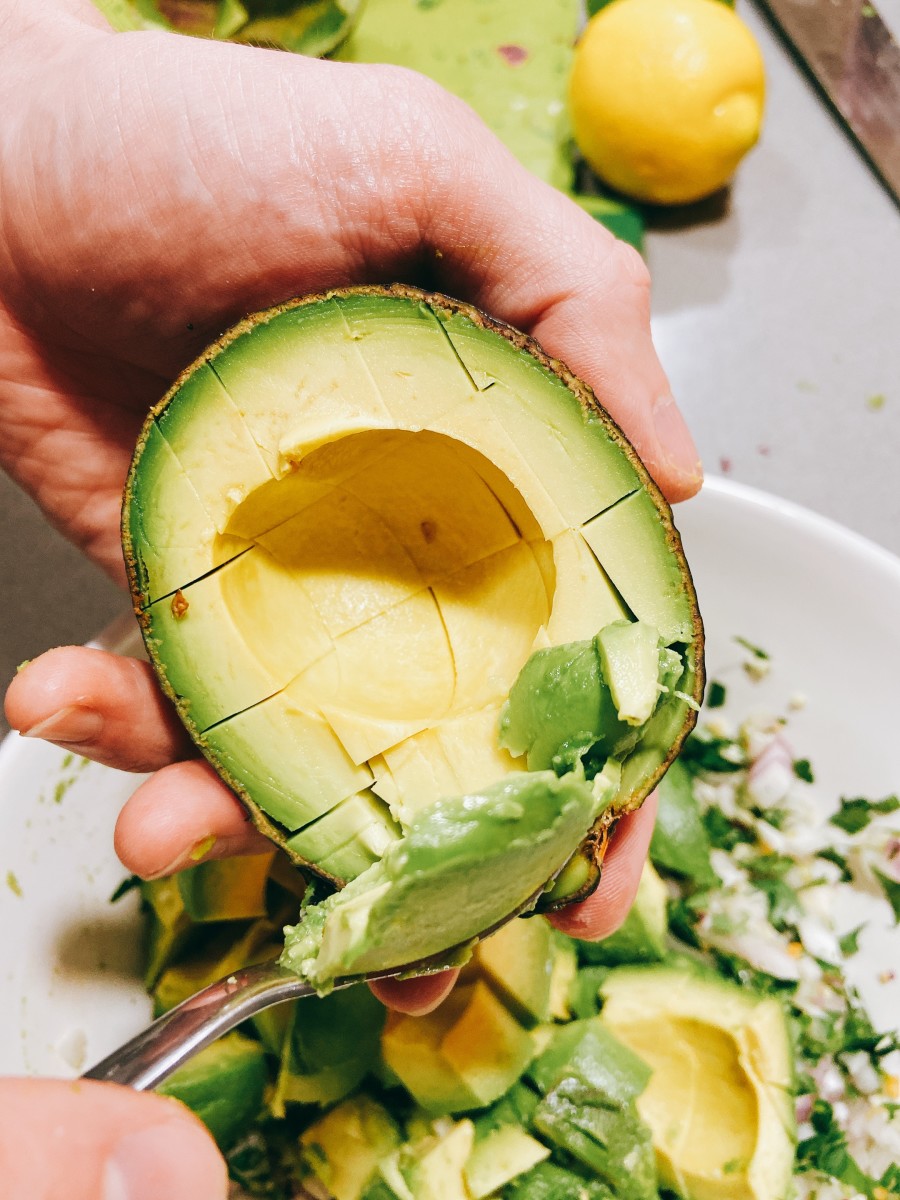 Scoop out the avocado with a large spoon and combine into the bowl. 