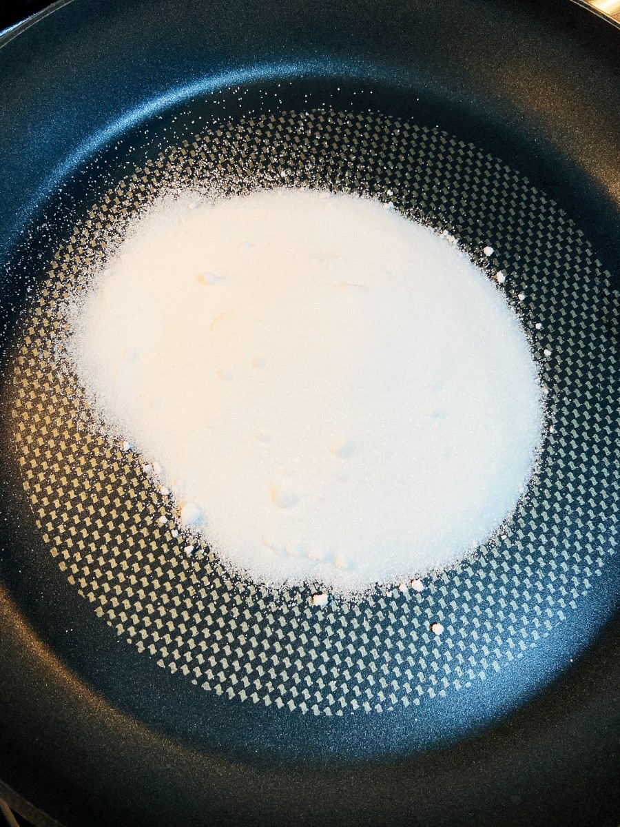 Pour 1 cup of sugar into the prepared pan.