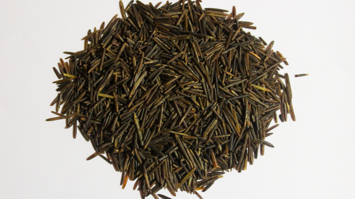 Naturally grown, hand-harvested Minnesota wild rice. Note the long grains, medium-brown color, and irregular lengths.