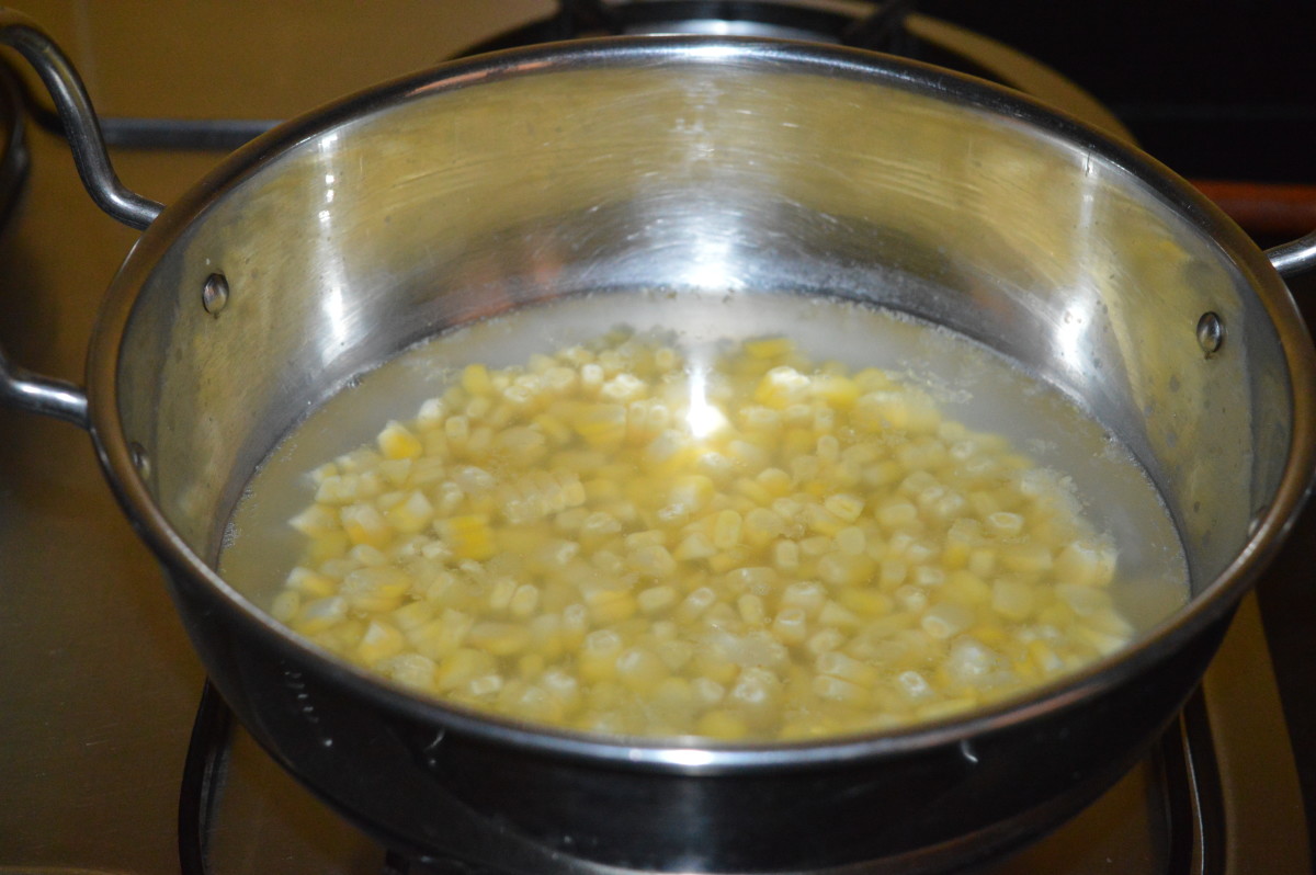 Step two: Add the remaining sweet corn kernels to a deep-bottomed pan. Add 4 cups of water. Bring this mixture to a boil.