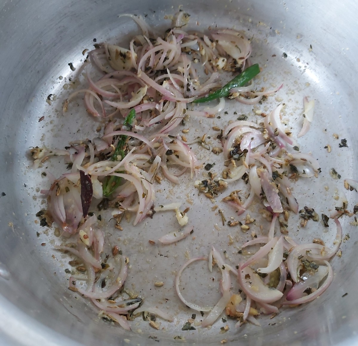 Mix and fry till onion turns brown and raw smell of ginger-garlic paste goes away.