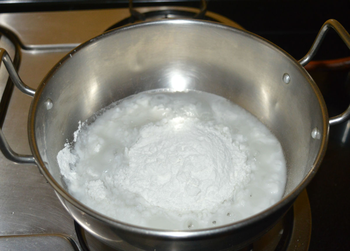 Add rice flour. Keep the heat medium-low. Simmer it for 2 minutes. Stir the mixture and turn off the heat.