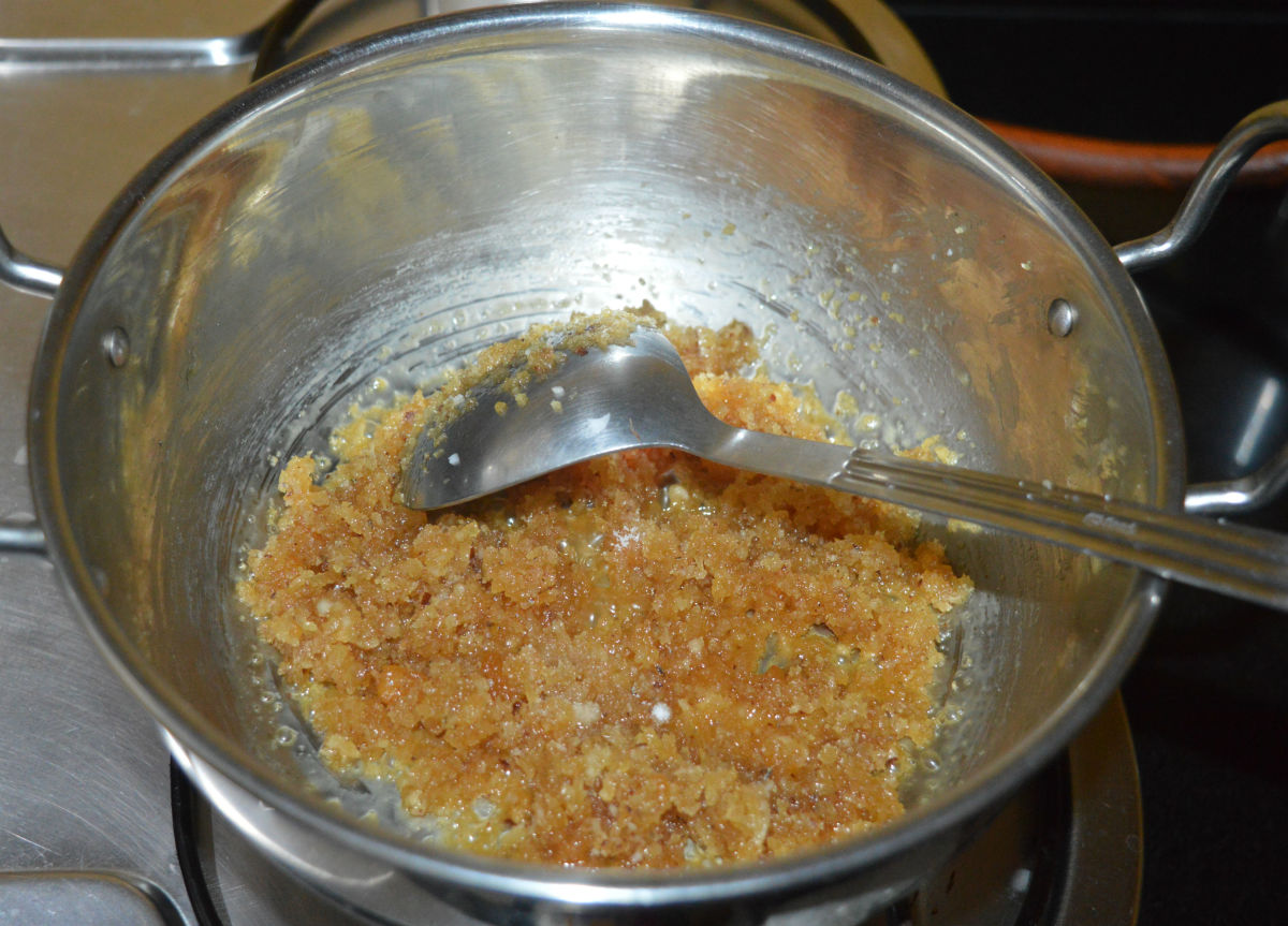 Saute over medium heat until the jaggery melts completely and the mixture becomes a little bit gummy.