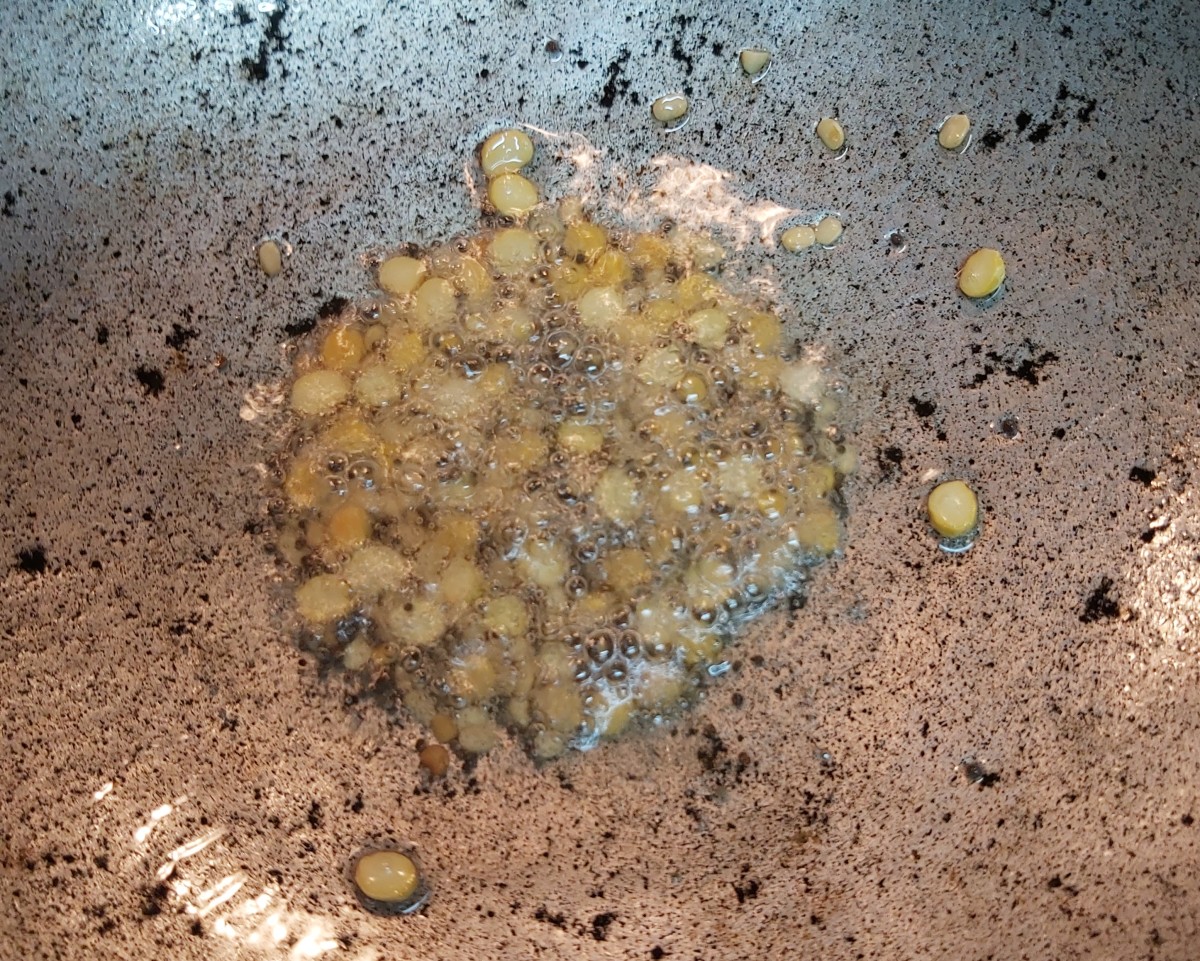 Add 1 tablespoon of Bengal gram; fry till golden brown.