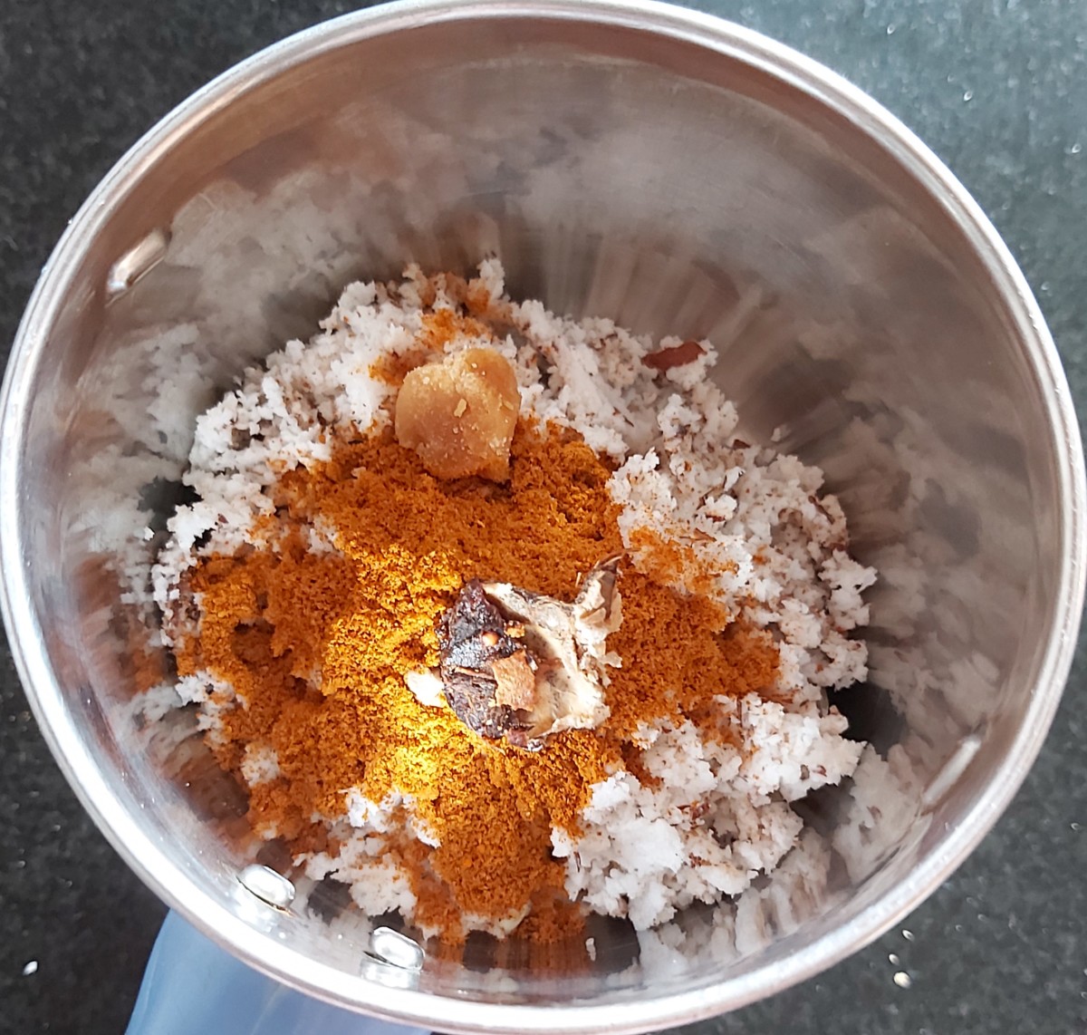 Add 1-2 teaspoons of sambar powder (homemade or store-bought), 1/2 teaspoon of tamarind pulp and 1/2 teaspoon of jaggery.