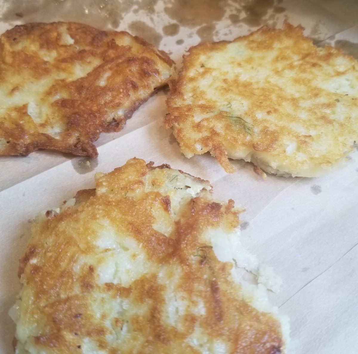 Remove excess grease by letting the potato pancakes drain on a paper towel or paper bag.