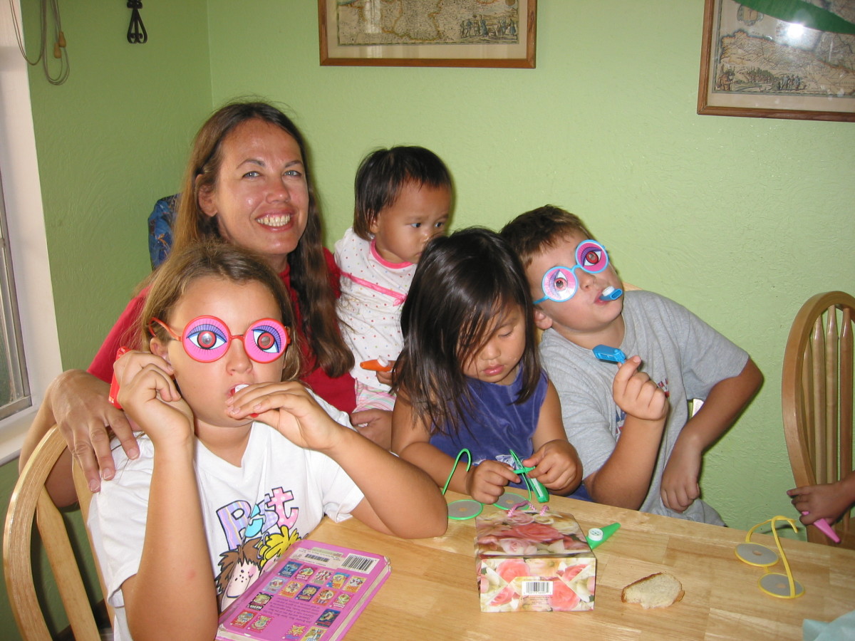 Family. Laughing together and playing together has a positive effect on families.