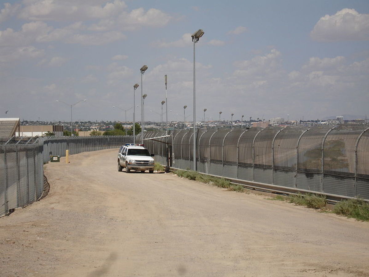 The border fence stretches along much of the otherwise most accessible sections of the border. Here, a patrol car maintains surveillance of the border.