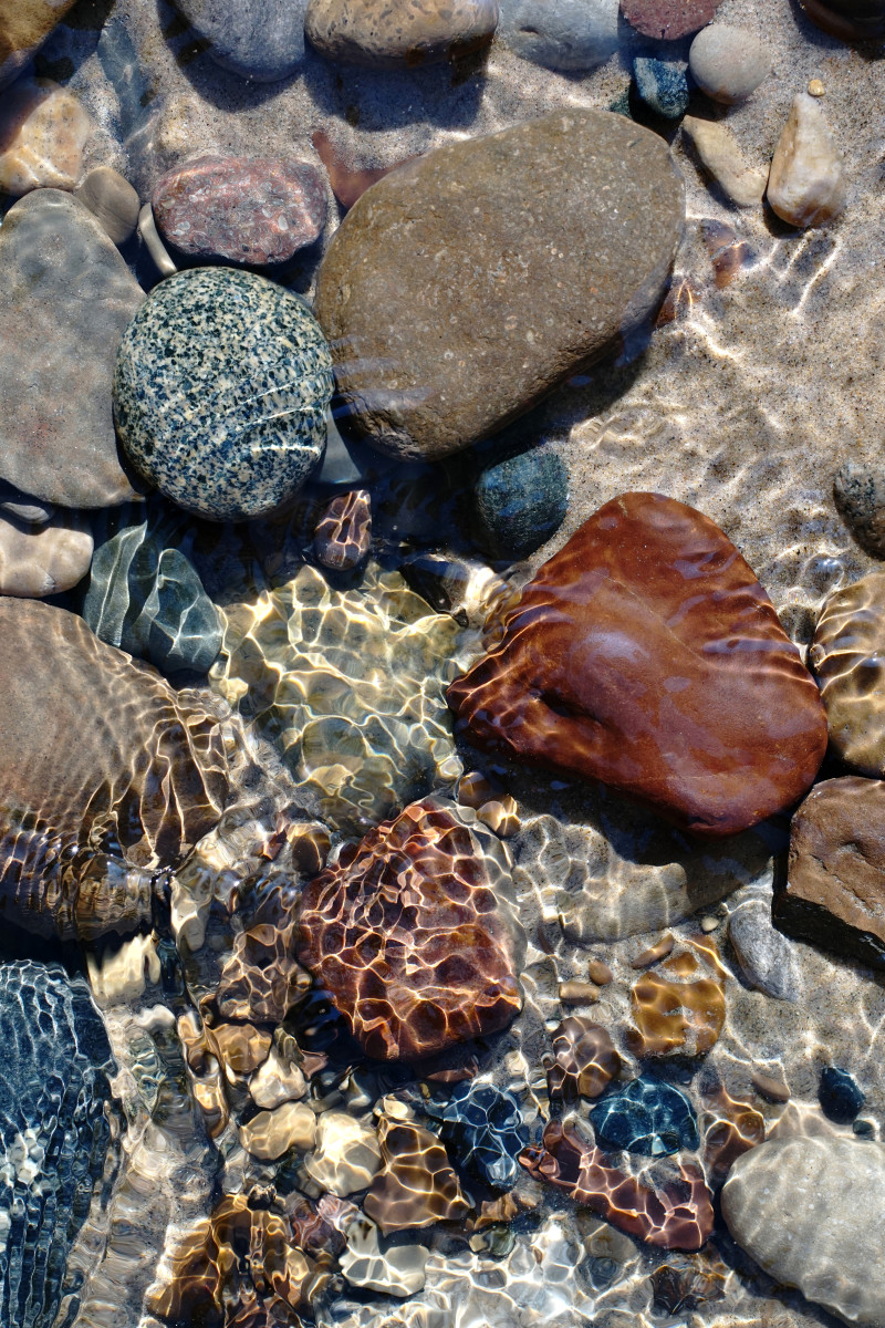 Lake Michigan beach boulders, cobble stones, pebbles at Pier Cove Creek  