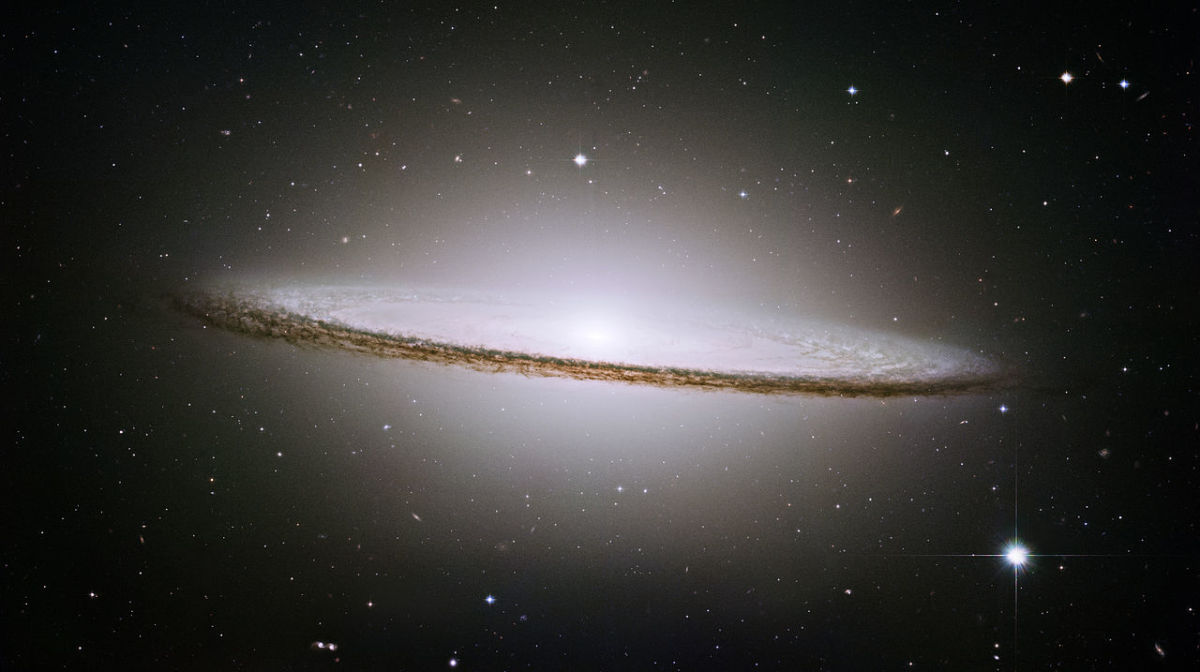 A photo of the Sombrero galaxy (M104). This galaxy is a bright, energetic elliptical galaxy. 