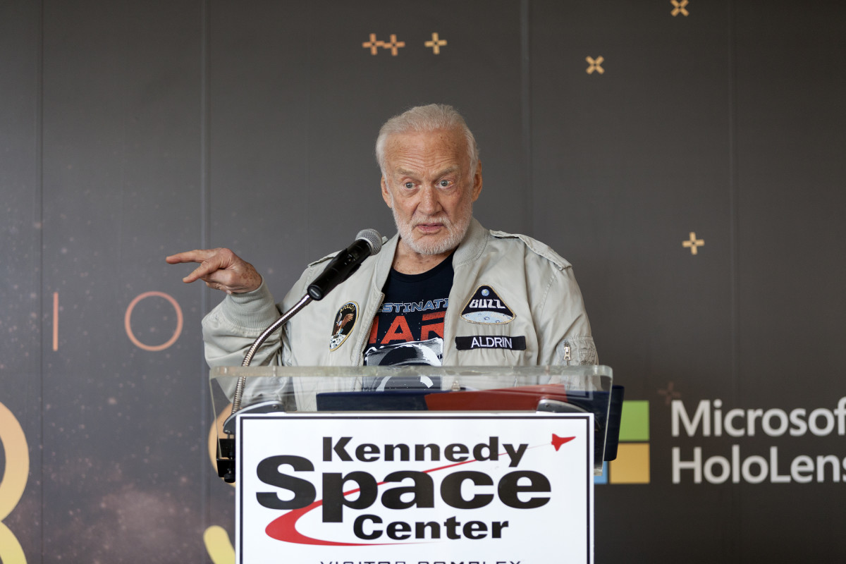 Buzz Aldrin speaks to members of the news media during a preview of the new Destination: Mars experience at the Kennedy Space Center Visitor Complex in 2016.