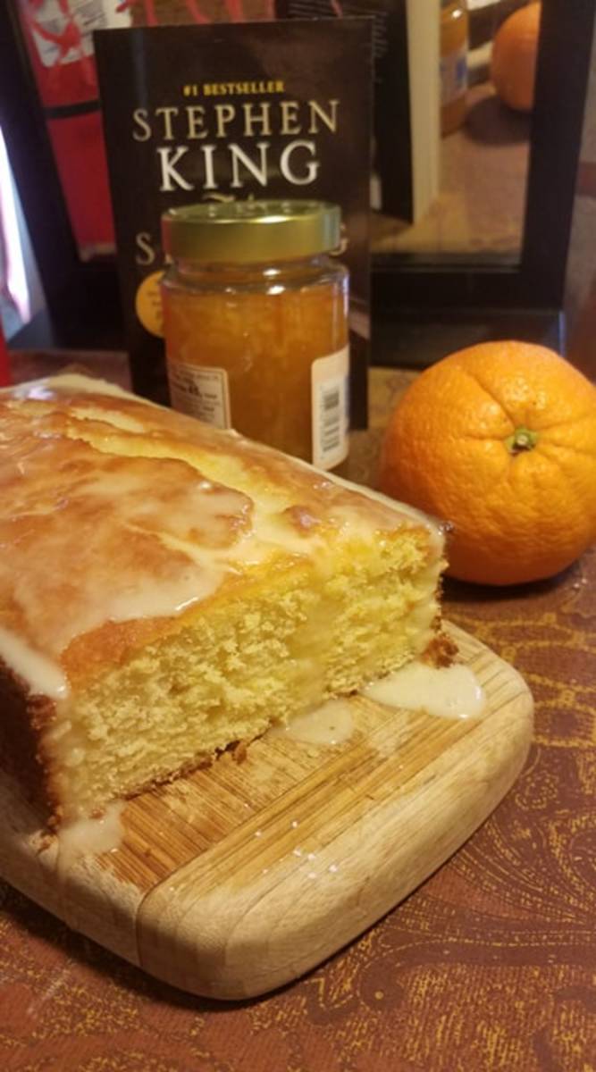 Pictured here are two main ingredients in this recipe: an orange and marmalade.