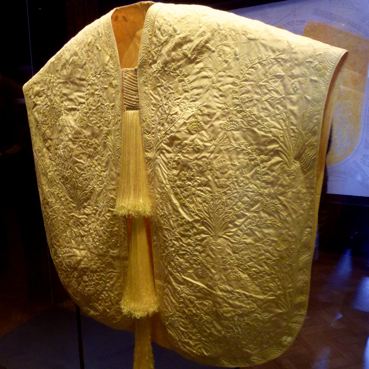 A cape made from golden orb spider silk exhibited at the Victoria and Albert Museum in London. Created by textile designer, Simon Peers, and entrepreneur, Nicholas Godley, who previously produced a shawl for the American Museum of Natural History.